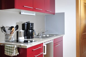 Fridge, stovetop, coffee/tea maker, toaster