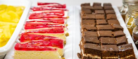A dessert tray with cheesecake and brownies.