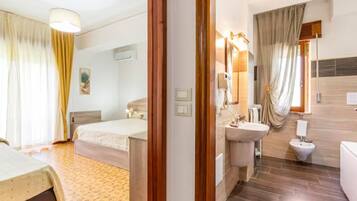 Standard Triple Room, 1 Bedroom, Bathtub | Minibar, in-room safe, desk, laptop workspace