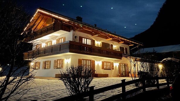 A two-story chalet with a balcony, wooden exterior, and multiple windows. - Apartment- 3 persons, 50sqm, 1 bedroom, balcony, WLAN (Oberwössen)