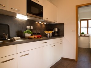 Fridge, microwave, stovetop, coffee/tea maker