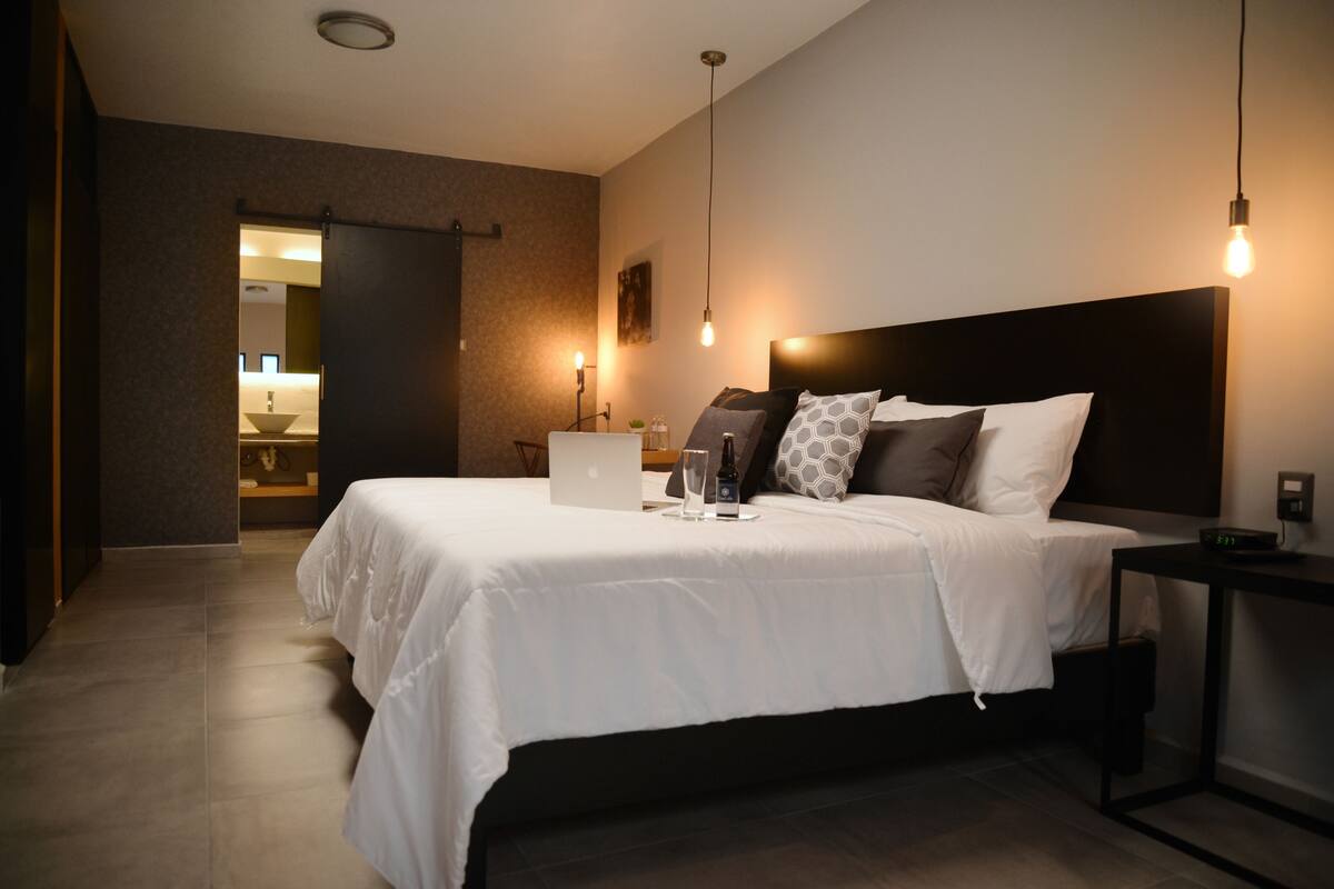 Junior Suite, 1 King Bed | In-room safe, desk, WiFi (free), bed sheets