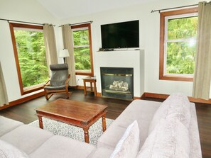 Premium Suite, 2 Bedrooms (Sandpiper) | Living room | Flat-screen TV - Cobble Wood & Bird Sanctuary Guest Houses (Tofino)