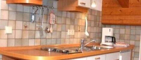 Fridge, stovetop, dishwasher, coffee/tea maker