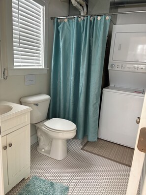 Combined shower/tub, hair dryer, towels, soap