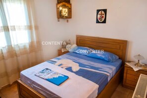 2 habitaciones y tabla de planchar con plancha 