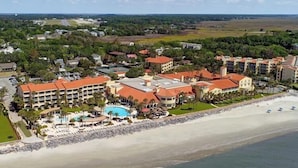 A resort with multiple buildings, a pool, and a beach. - Family Friendly, King & Prince South Villa with Beach and Resort Amenities (St Simons Island)