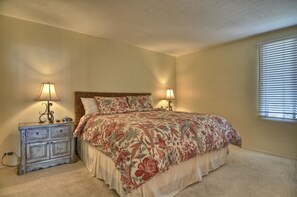 A bedroom with a bed, two bedside tables, and a window with blinds. - Gorgeous 2+Den! At the Pier/Beach! Panoramic Views! (San Clemente)