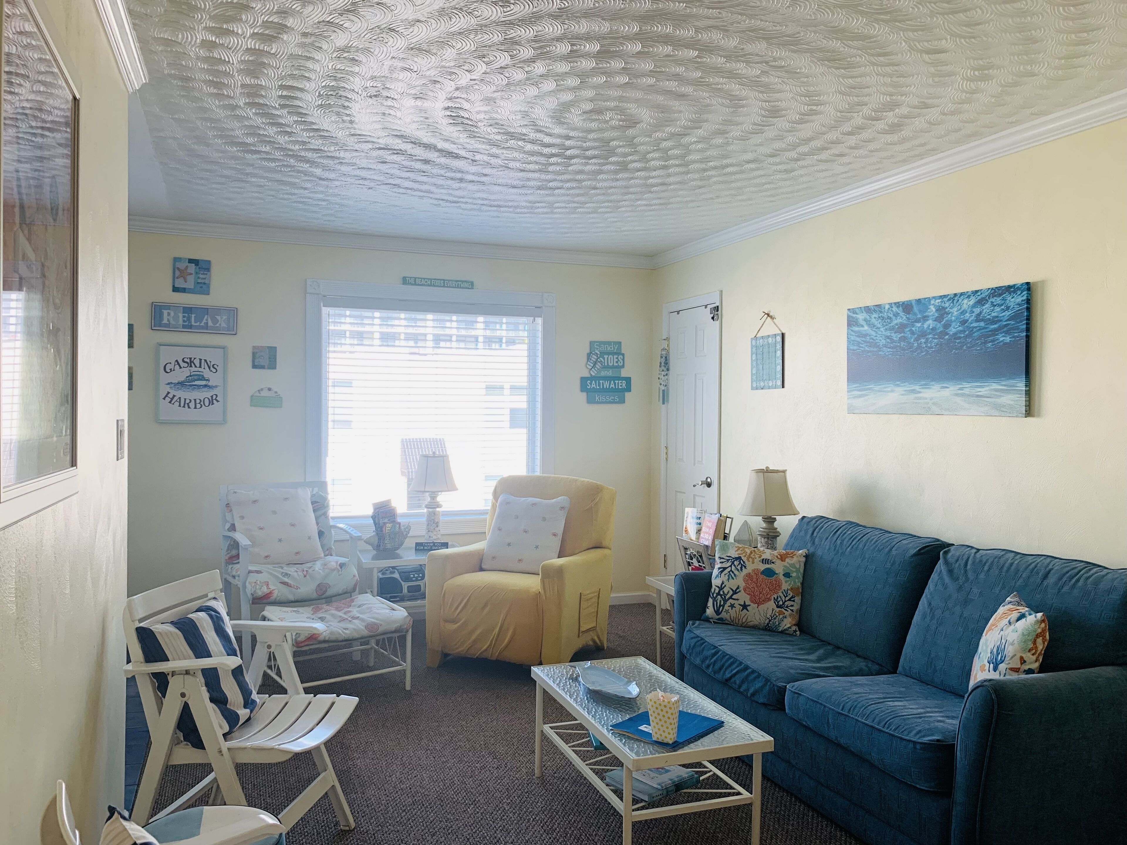 Open concept living room to breakfast nook on left. Overlooks parking lot