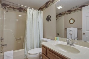 Combined shower/tub, towels, soap, shampoo