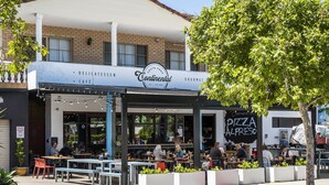 A café with outdoor seating, a sign reading "Continental," and a "Pizza Alfresco" sign. - Great value 2 bedroom apartment in the heart of South Fremantle (Fremantle)