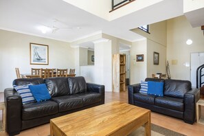Flat-screen TV, DVD player, books