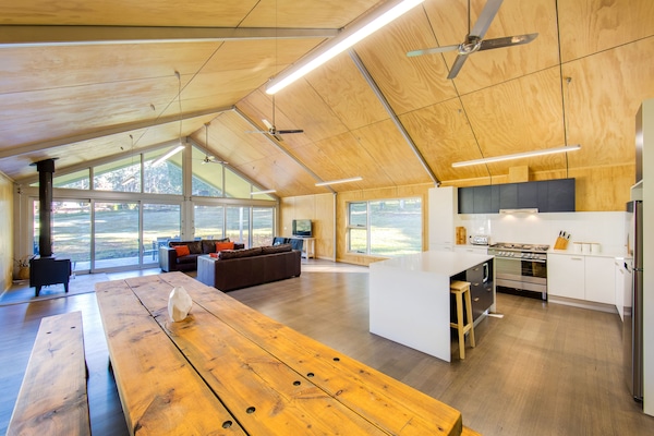The great room with a cook's kitchen and 3.7 metre locally made dining table