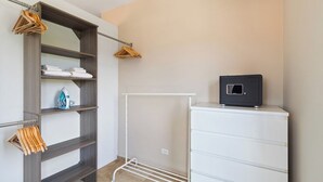 A room with a wardrobe, a drying rack, and a small cabinet. - Upscale 5BR Villa: Game Room, Private Pool, Patio (Noord)