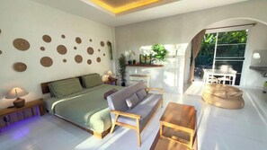 Bungalow superior, vista al jardín | Área de sala de estar