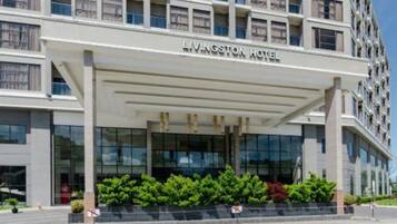 A modern building with a sign reading "Livingston Hotel".