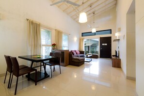 Premium Villa, 1 Bedroom, Balcony | Living area | 24-inch LCD TV with cable channels - Rainforest Resort and Spa, Igatpuri -Nature's Luxury Awaits (Igatpuri)