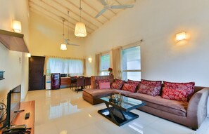 Premium Villa, 1 Bedroom, Balcony | Living area | 24-inch LCD TV with cable channels - Rainforest Resort and Spa, Igatpuri -Nature's Luxury Awaits (Igatpuri)