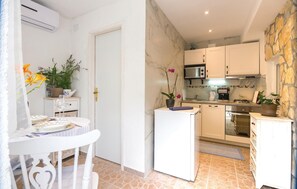 Fridge, stovetop, dishwasher, coffee/tea maker