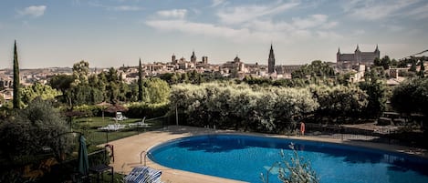 Seasonal outdoor pool, open 11:30 AM to 9:00 PM, pool umbrellas