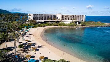 On the beach, sun loungers, beach towels
