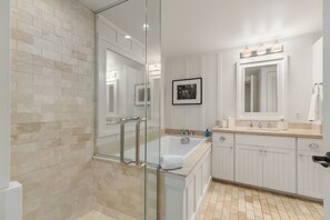 Combined shower/bathtub, hair dryer, towels, soap