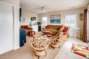 Flat-screen TV, DVD player, books, video library
