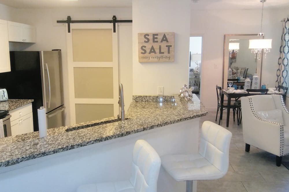 Designer Boutique style "Sea Salt Condo" coastal getaway, On The Ground Floor ,(no stairs to lug suitcases or groceries up and down from), offers you a gorgeous home away from home, with all of the ammenities, to provide you with an unforgettable coastal vacation. Newly & Completely Renovated and Professionally Decorated 2bed/2bath, ground floor condo in a resort style, gated community of AVALON AT CLEARWATER, just 5min drive to the world famous Clearwater Beach. The condo offers a Split Floorplan with the 2 bedrooms on opposite sides offering guests maximum privacy allowing for a very comfortable stay for a family or 2 couples. Amenities include a gorgeous, resort style, salt water pool area, bbq area, gazebo and fitness center all nestled between beautiful court yards. Condo features modern 12x24 porcelain tile throughout,(no carpeting anywhere for mold to lurk under), king beds and flat screen tv\'s in both bedrooms. Master has an ensuite w/step in rain head shower & walk-in closet. Both bathrooms have been completely re done brand new with new tiling, bathtub, shower and vanities. Queen sofa bed in the great room with upgraded plush mattress. Beautiful private Lanai with comfortable seating to enjoy your morning coffee or afternoon cocktail with walkout from the Master as well as the Great room. Great room features 50" flat screen LED TV with free WiFi. Fully stocked kitchen w/granite counter tops, all new white shaker style cabinets & stainless steel appliances, refrigerator has ice maker in the freezer drawer. <br><br> Condo is stocked w/beach chairs, beach umbrellas, beach towels, cooler & large beach mat for your fun on the areas many beautiful beaches, try a different beach every day or relax in the resort style heated pool. <br><br> Laundry room just off the kitchen. Conveniently located and central to Tampa/Clearwater/St.Pete airports, Clearwater Beach, Golf etc.. Relax & enjoy your vacation in high end coastal style! Perfect for those with allergies as all carpets have been removed and all shower enclosures remodeled.<br> Please call or email Alexandra with any pet inquiries.<br><br>You will enjoy your stay and be centrally located to all of the areas beaches and attractions. Grocery store and restaurants within walking distance right outside your door. Free parking steps from your front door!<br><br>We welcome you and know you will enjoy your stay in our Stunning, Sea Salt Condo,Coastal Retreat!<br>*Check out our New Listing ID #1509884 SEAVIEW on Honeymoon Island Causeway* Stunning Luxury