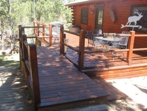 Step out onto the deck and enjoy a meal or moment of relaxation amidst the forest surroundings.