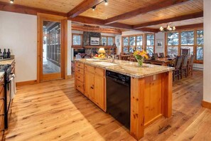 Enjoy cooking in this well-equipped kitchen with a large island and dishwasher.