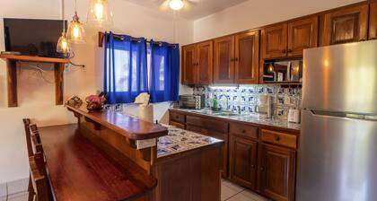 Breezy 2-story oceanfront condo with pool, sea views & partial AC