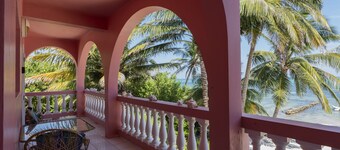 Breezy 2-story oceanfront condo with pool, sea views & partial AC