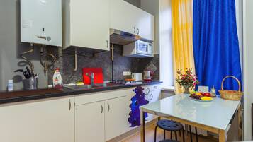 Familiekamer | Een strijkplank/strijkijzer, gratis wifi, beddengoed