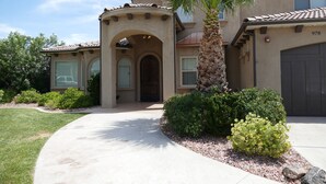 A two-story house with a stucco exterior, a tiled roof, and a garage door marked with the number 978. - PRIVATE POOL 34'x18', 25 Minutes to Zion,  Playset for Kids, 7 bdrm, sleeps 32 (Hurricane)