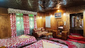 A traditional room with two beds, wooden furniture, and a patterned ceiling. - Shiraz Deluxe Houseboat (Srinagar)