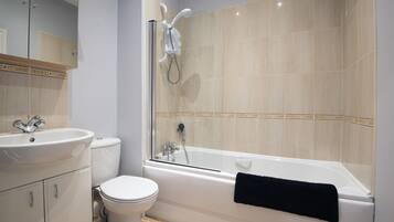 Combined shower/bathtub, hair dryer, towels, soap