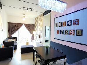 The Woodz x Family | Living area | 32-inch flat-screen TV with satellite channels, TV