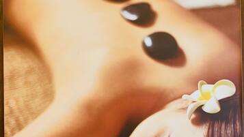 A poster of a massage therapy session at the Berjaya Times Square, Kuala Lumpur Hotel.