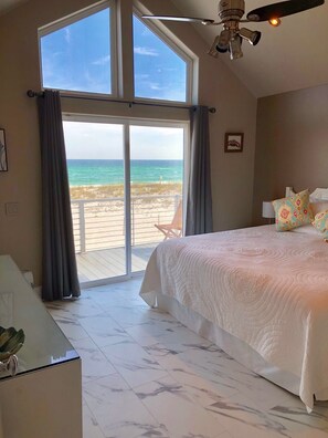 Enjoy ocean views from the large window, relax in the bed with a quilted bedspread, and work at the desk with a lamp.