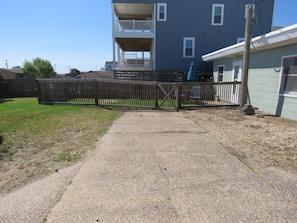Enjoy a home away from home with a balcony overlooking the surrounding lawn and an entrance.
