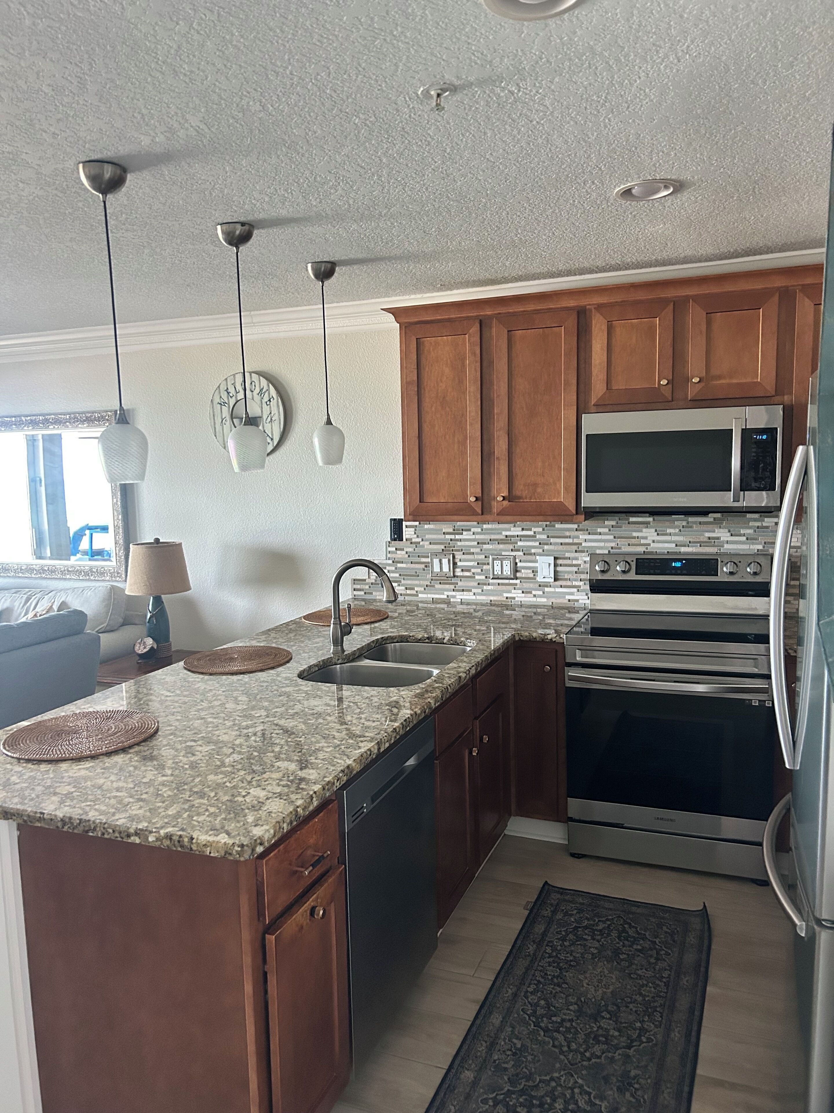 Coffee/tea maker, fridge, microwave, oven