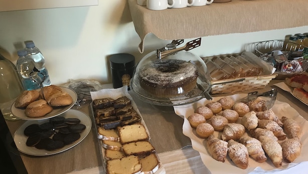 A buffet table with various desserts, including cakes, cookies, and pastries. - L'Antico Monastero (Sant'Agata di Puglia)