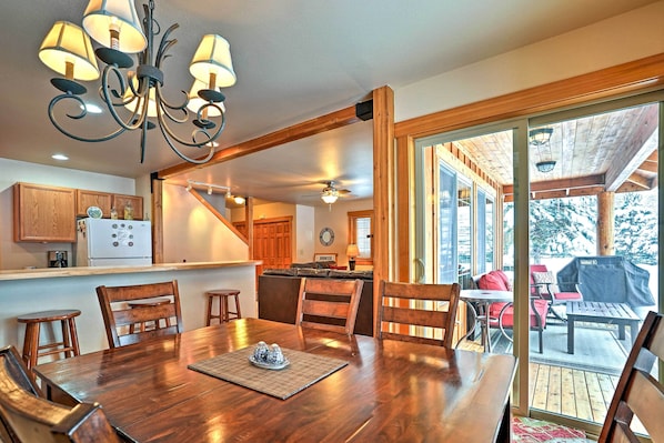 Enjoy meals in this inviting dining area with a large table and comfortable seating.
