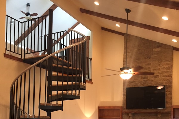 Soaring ceilings and massive fireplace