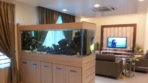 Executive Bungalow | Living room | Flat-screen TV