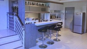 Executive Bungalow | Private kitchen | Coffee/tea maker, full-size fridge, microwave, oven