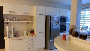 Executive Bungalow | Private kitchen | Coffee/tea maker, full-size fridge, microwave, oven