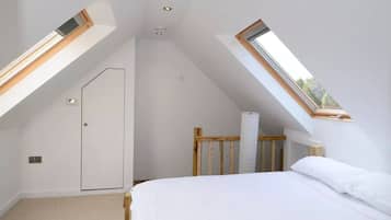 1 bedroom, desk, iron/ironing board, travel crib
