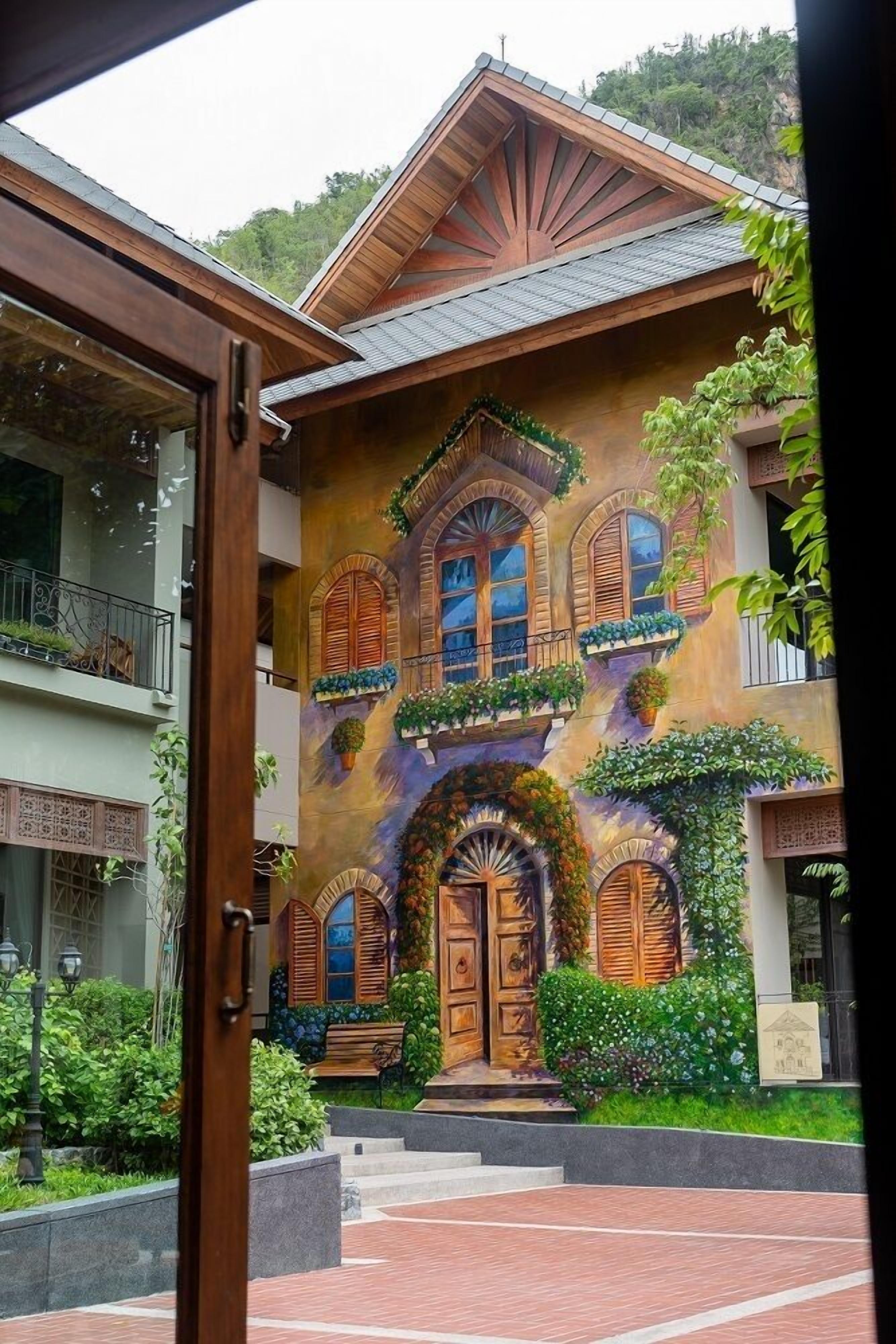 A building with a traditional facade, multiple windows, and a central entrance.
