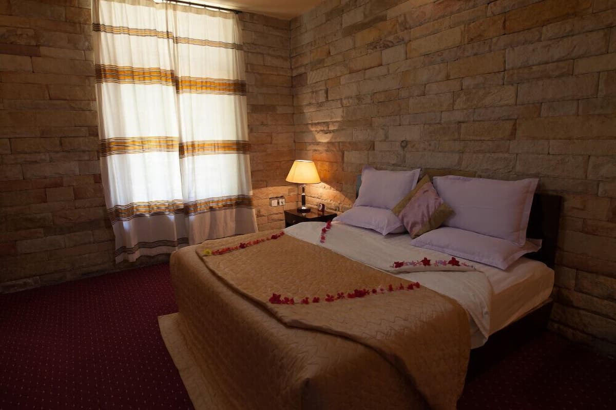Family Suite, 2 Bedrooms, Refrigerator & Microwave, Garden View | 1 bedroom, premium bedding, minibar, in-room safe